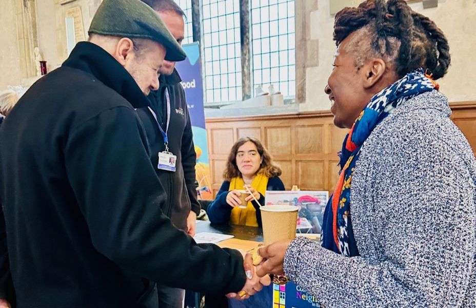 Carers shaking hands at a networking event in the City of London